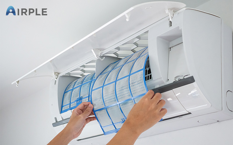 Technician repairing aircon