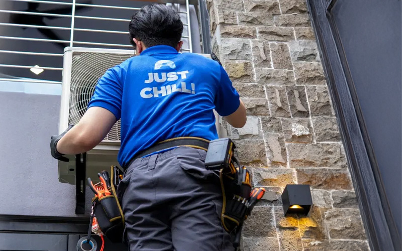 Technician installing an aircon unit for reliable performance.