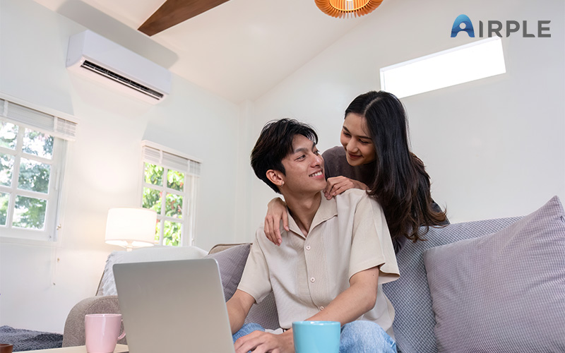 Couple at home with aircon