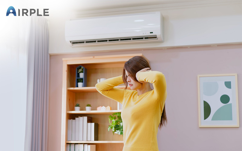 Person suffering from having a noisy aircon