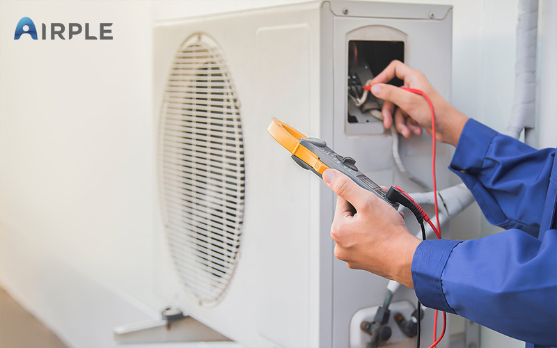 Professional maintenance checking on refrigerant level