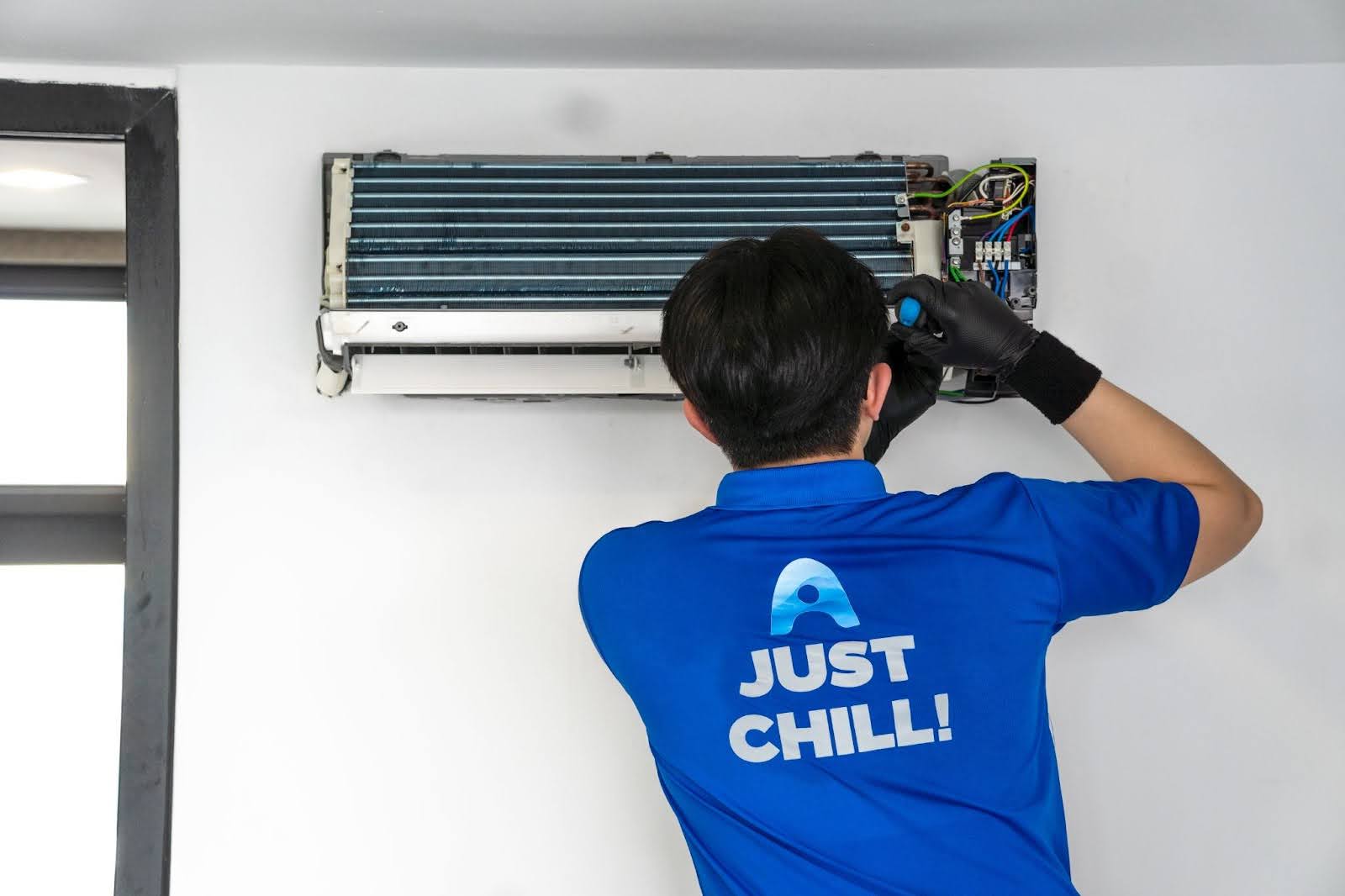 Airple technician repairing aircon
